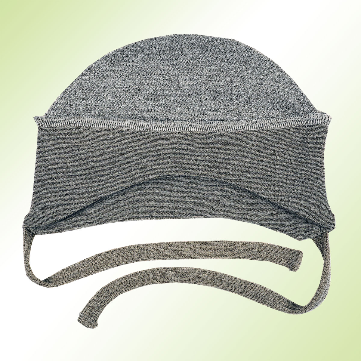 Silver textile baby hat. Very light and breathable, with ties to ensure a secure fit. On a green background.